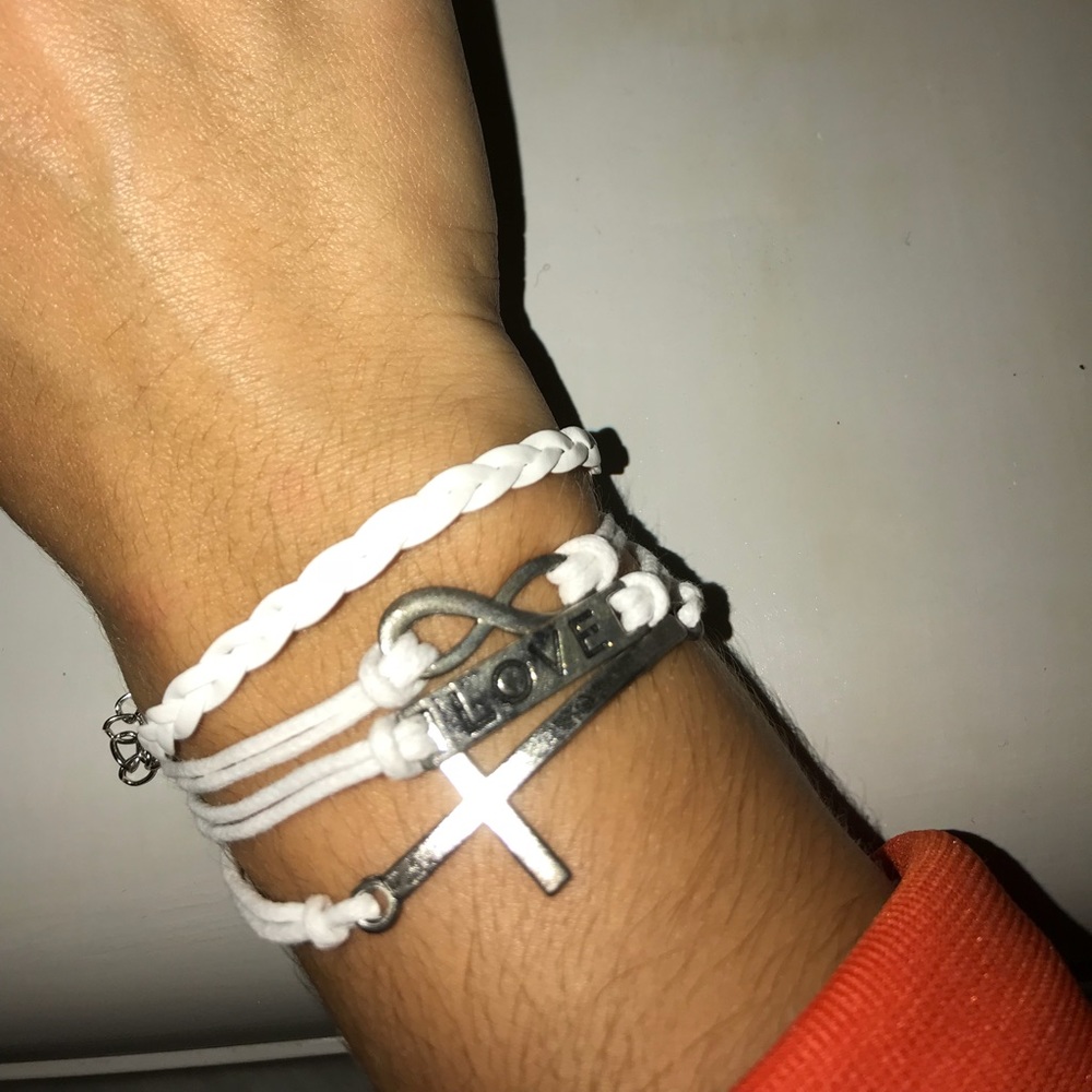 White bracelet with charms on it.